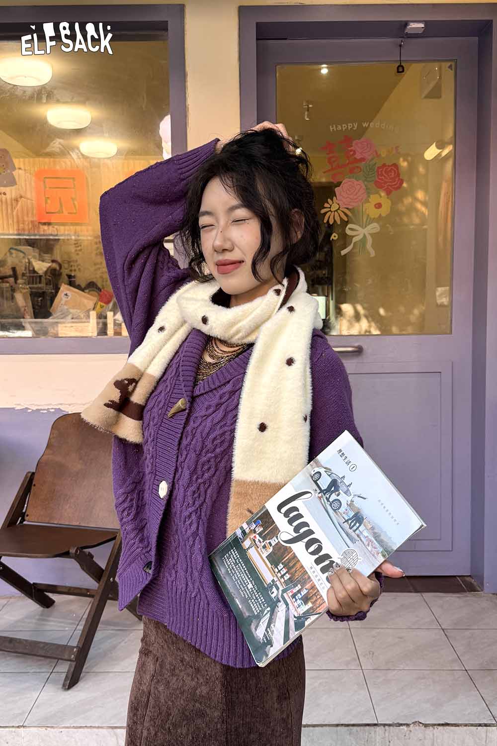 ELFSACK cartoon puppy fleece scarf styled with a cozy purple sweater and holding a magazine