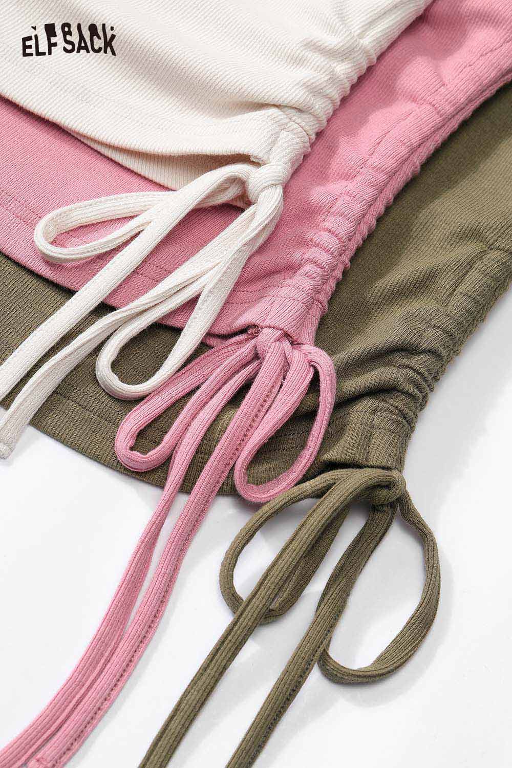 ELFSACK cartoon stitch detail fitted tee in three colors: white, pink, and olive green with gathered drawstring.
