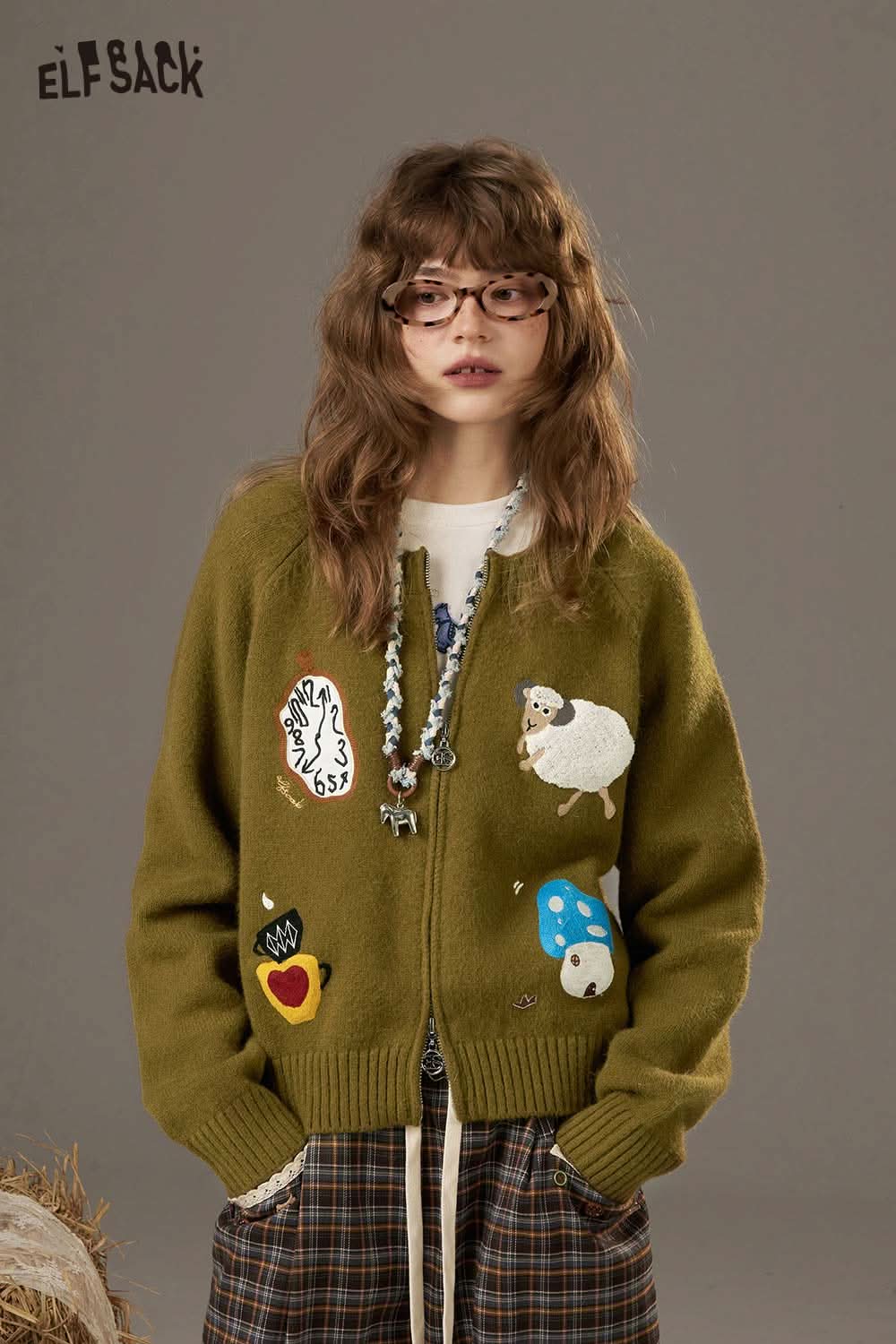 ELFSACK cartoon sweater cardigan for women in olive green with quirky animal and object patches