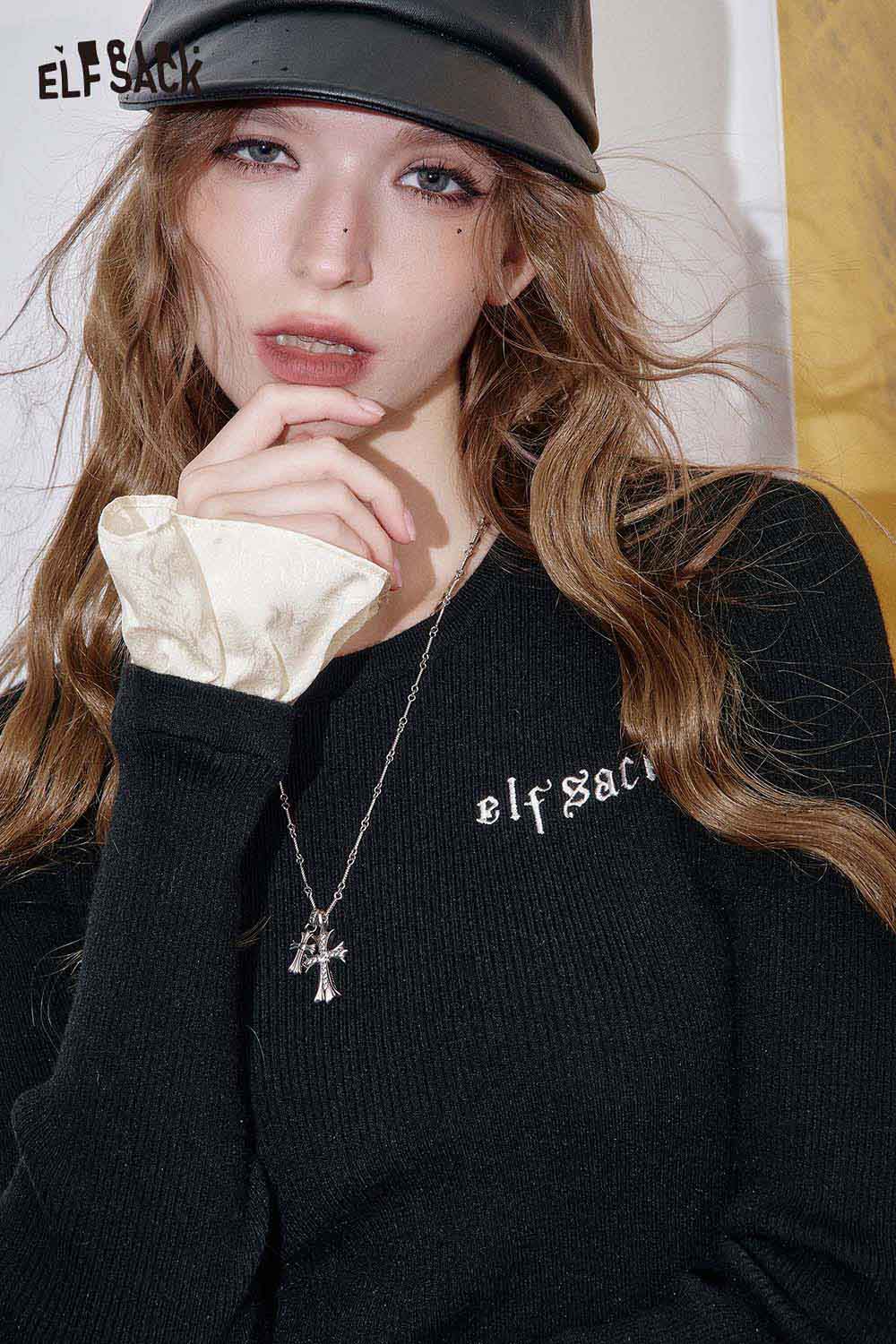 ELFSACK cashmere blend slim fit knit top in black with stylish logo and layered sleeves
