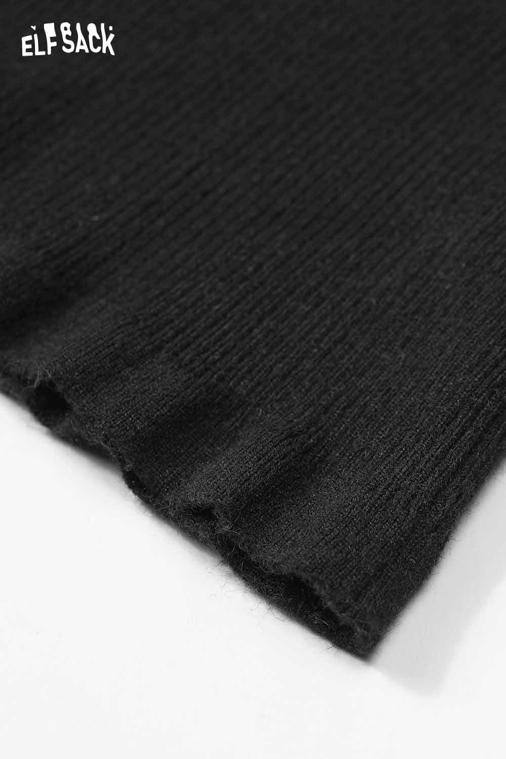 Close-up of ELFSACK cashmere blend slim fit knit top with a ribbed hem design