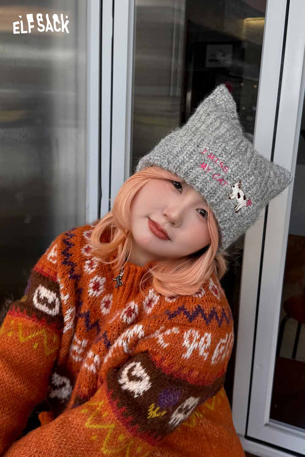 ELFSACK cat ear beanie for women in gray, styled with a colorful sweater for a cozy look