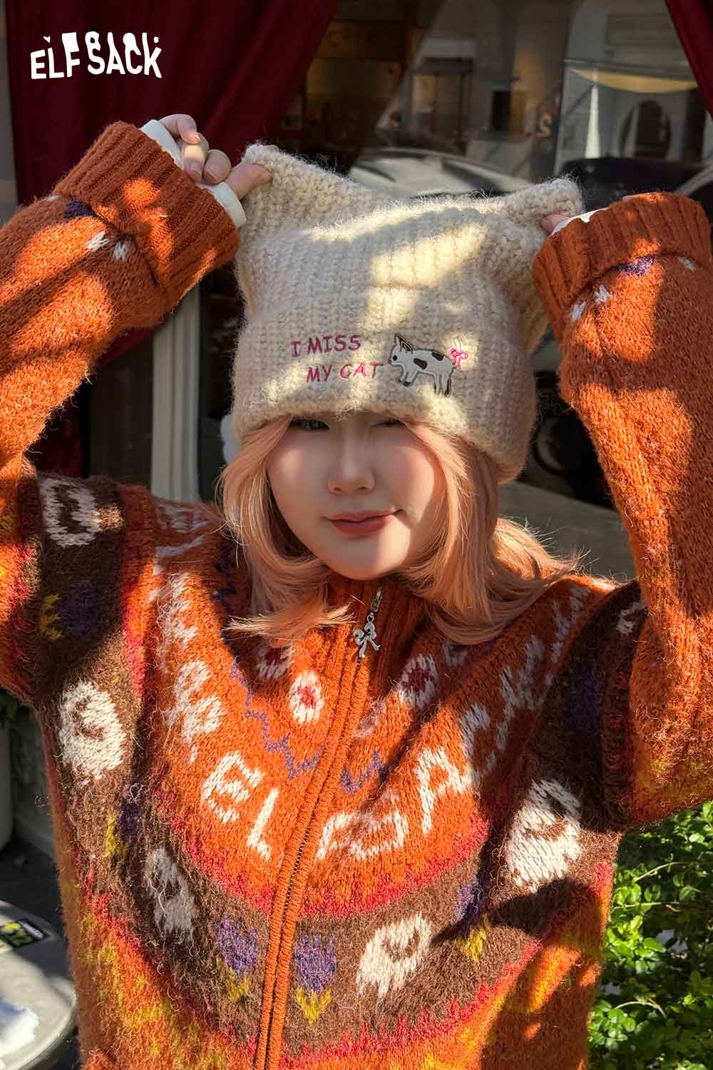 
                  
                    ELFSACK cozy cat ear beanie for women with 'I Miss My Cat' design and soft knit material
                  
                