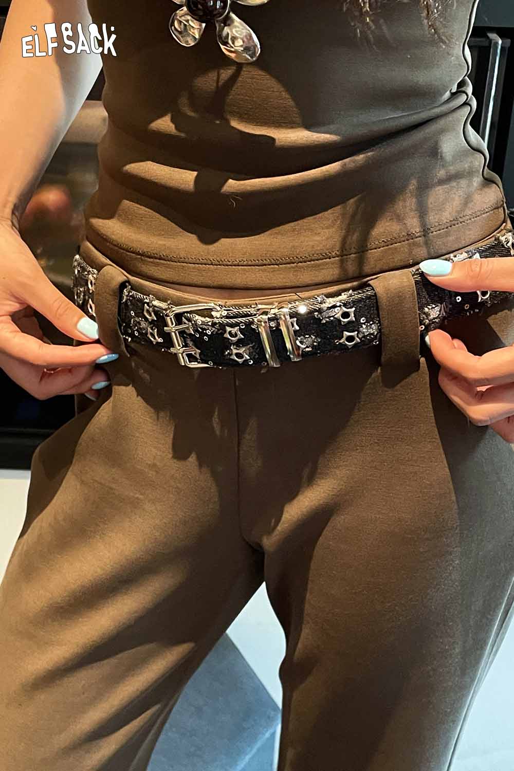ELFSACK celestial motif leather belt for women styled with casual outfit and adjustable buckle