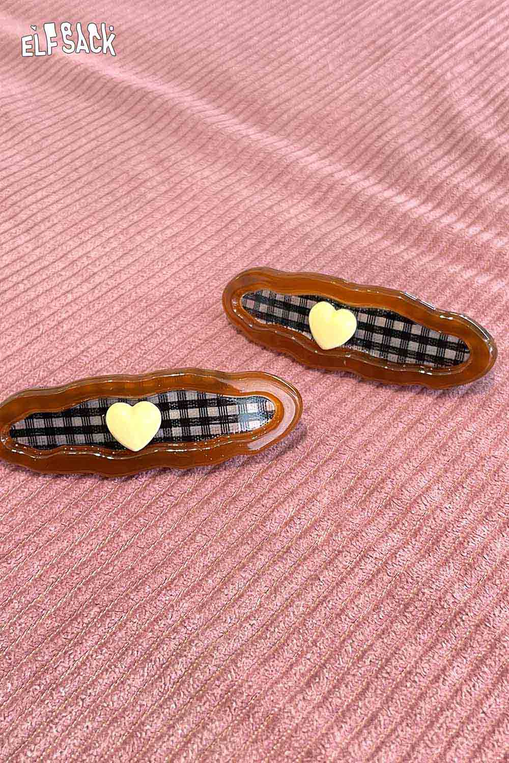 Checkered resin hair clip with a heart accent for stylish hair accessories