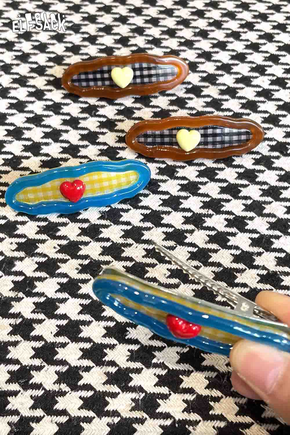 Checkered resin hair clip set in various colors featuring heart designs for stylish hair accessories