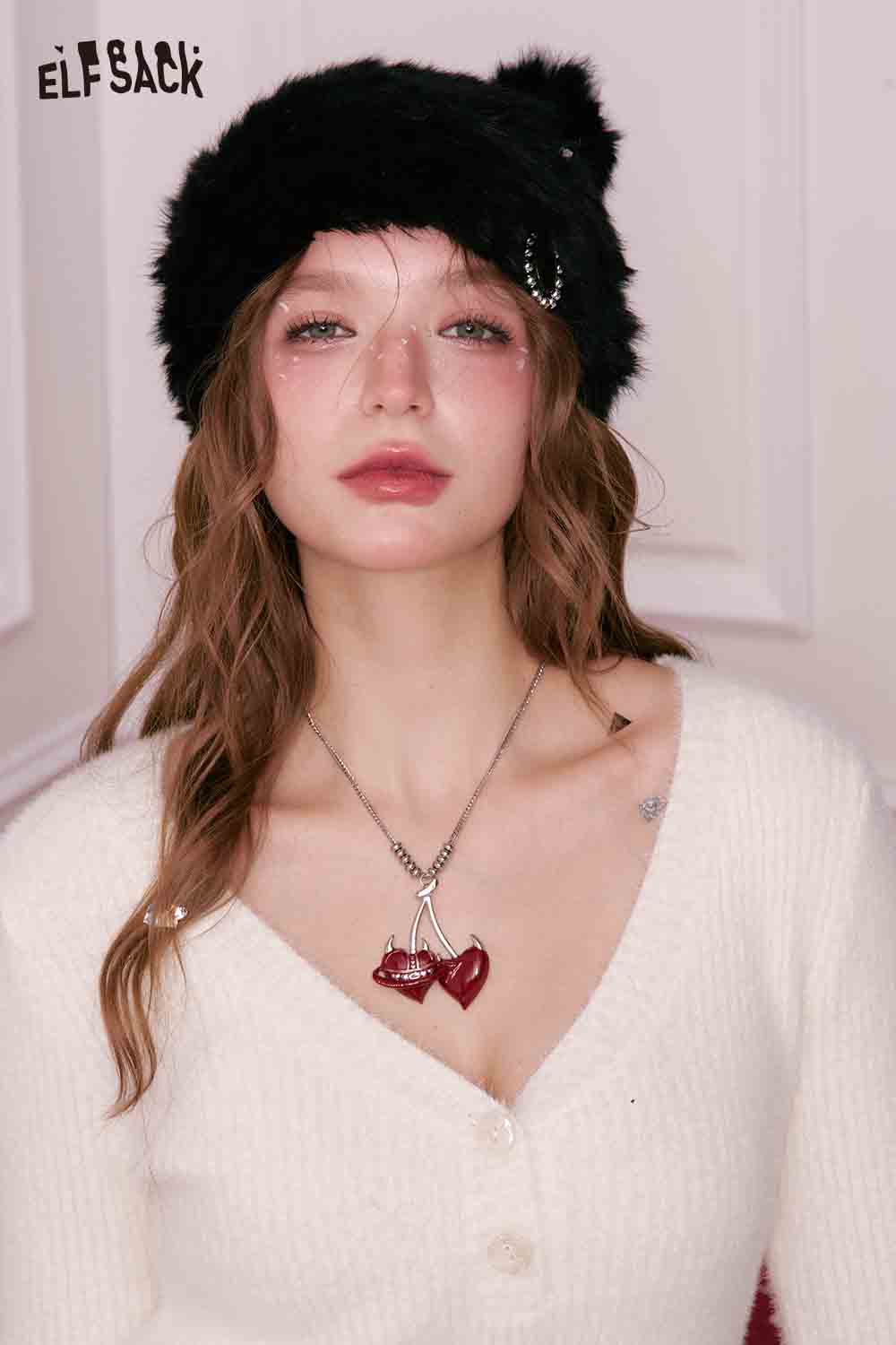 ELFSACK Cherry Pendant Heart Necklace on model with black fur hat and white sweater