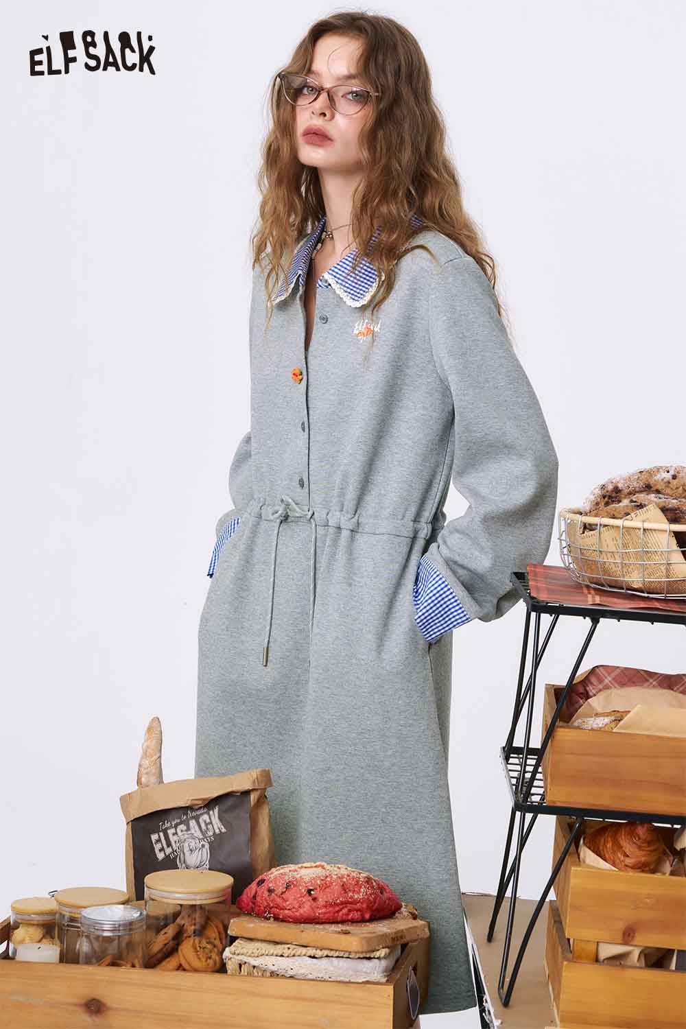 ELFSACK model wearing gray cinched waist dress for women with long sleeves blue check collar and pockets