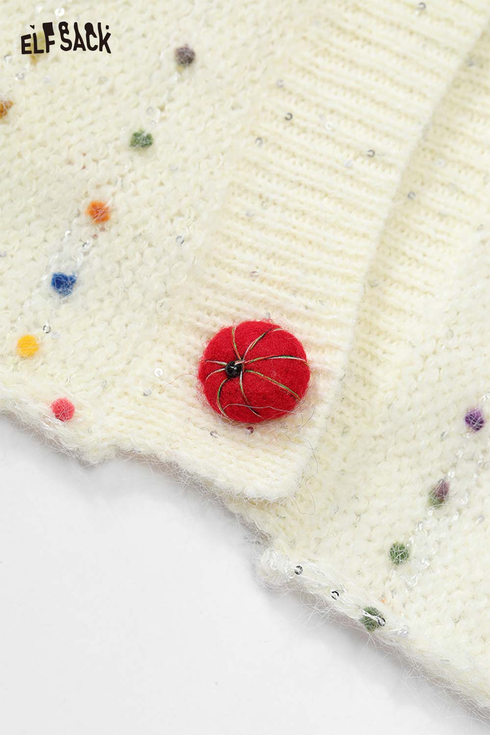ELFSACK chunky v-neck cardigan for women in soft white with colorful dot details and a red button closure