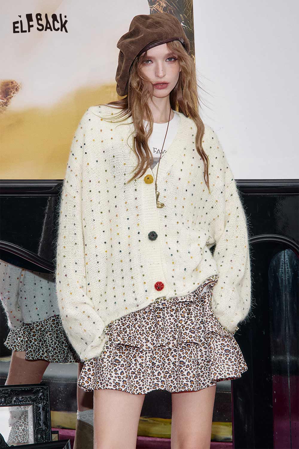 ELFSACK chunky v-neck cardigan for women in cream with colorful buttons styled over a leopard print skirt