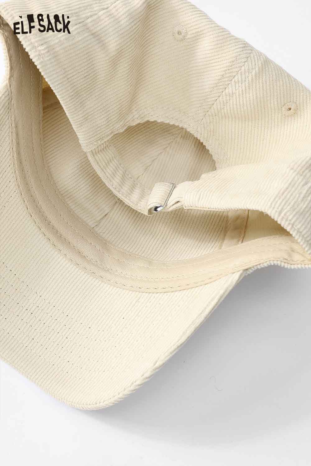 Cream ELFSACK corduroy baseball cap for women with adjustable strap and soft interior lining