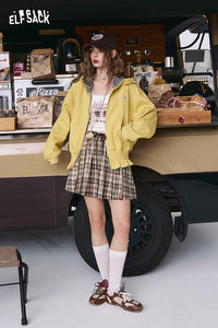 ELFSACK college style hooded jacket in yellow, paired with a plaid skirt for a casual look