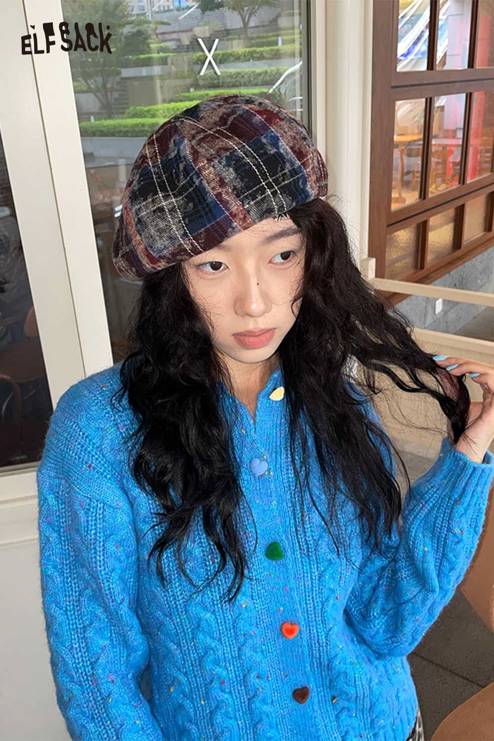 ELFSACK color blocked knitted beret in plaid design worn by a model with curly hair