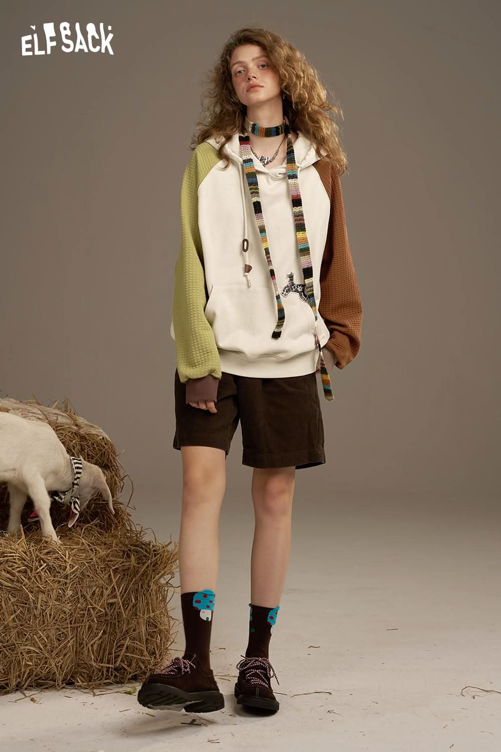 ELFSACK colorblock raglan sleeve sweatshirt in beige, green, and brown, styled with shorts and accessories