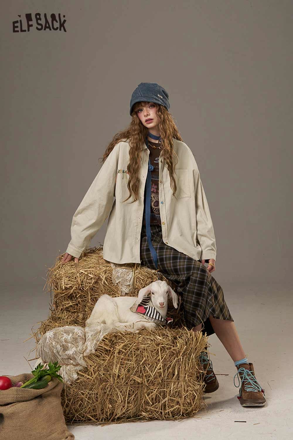 Model wearing a stylish colorful button pocket shirt for women, sitting on hay bales with a dog