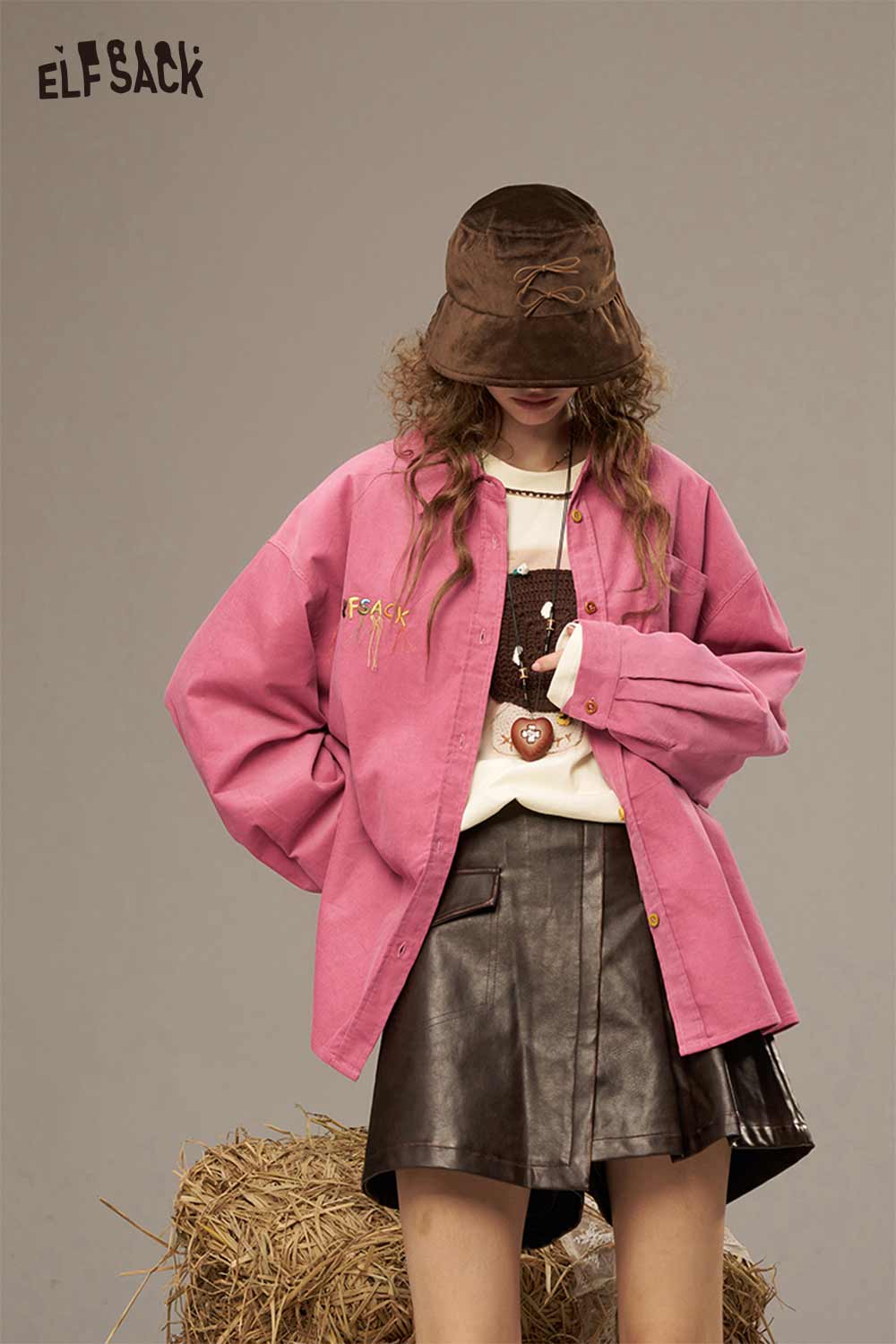 ELFSACK colorful button pocket shirt for women in pink, styled with a bucket hat and leather skirt.