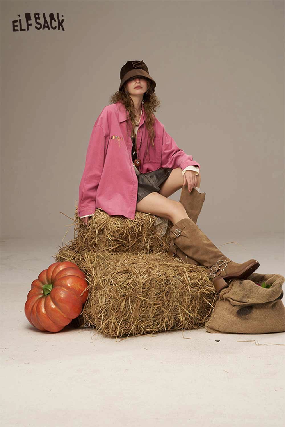 Colorful button pocket shirt for women styled with a skirt and accessories among hay bales and pumpkins