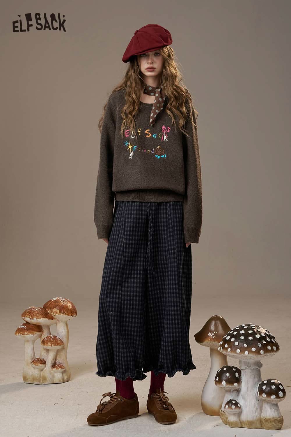 Elfsack colorful logo embroidery sweater paired with a long skirt and styled with accessories