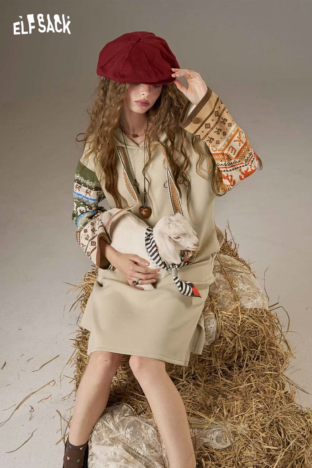 ELFSACK colorful print hooded sweatshirt dress featuring vibrant patterned sleeves and a relaxed fit