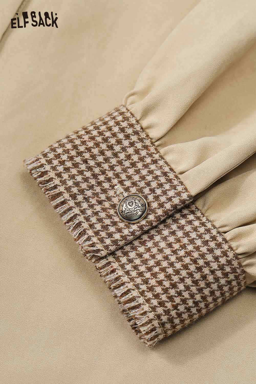Detail of ELFSACK contrast panel oversized shirt featuring a stylish collar and textured cuffs