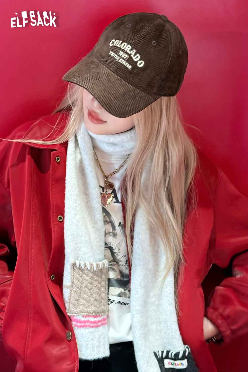 Brown ELFSACK corduroy baseball cap for women with Colorado graphic detail, styled with a red jacket