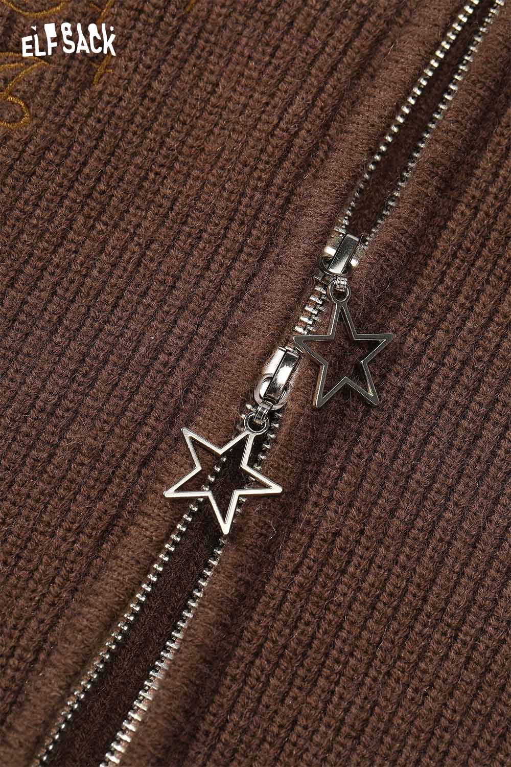 Close-up of ELFSACK cotton blend embroidered zip up sweater featuring star-shaped zipper pulls