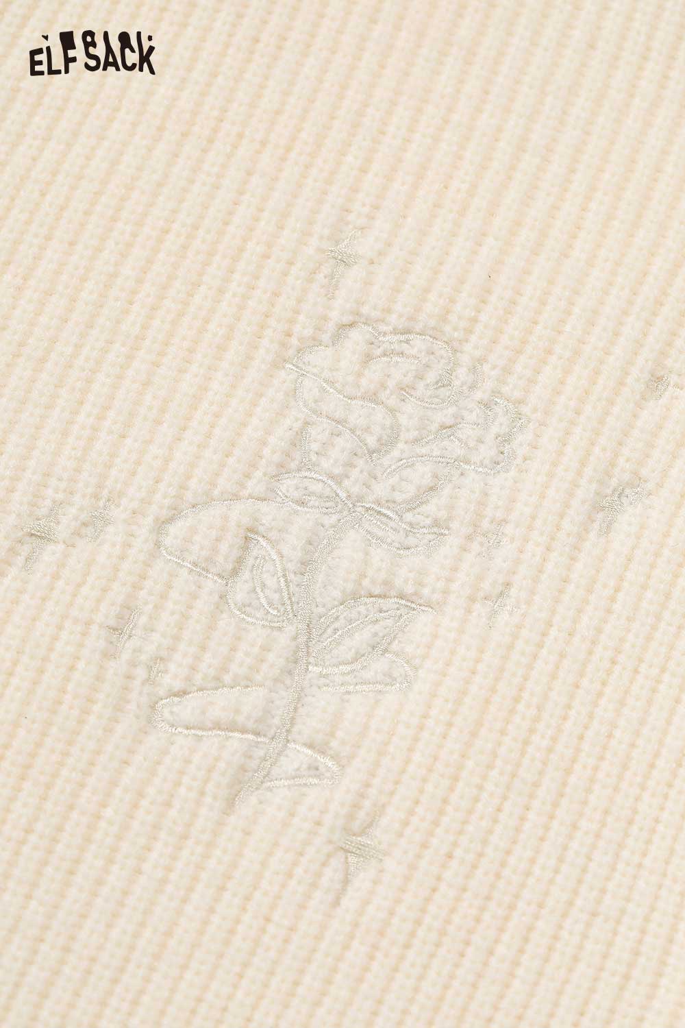 Close-up of ELFSACK cotton blend embroidered zip up sweater featuring delicate floral embroidery