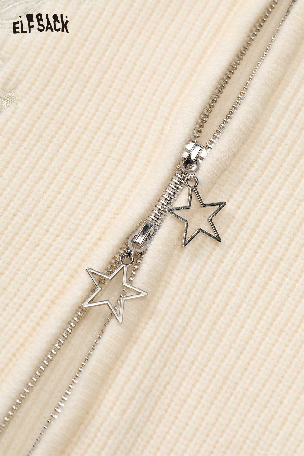 Close-up of ELFSACK cotton blend embroidered zip up sweater with star zipper pull detail