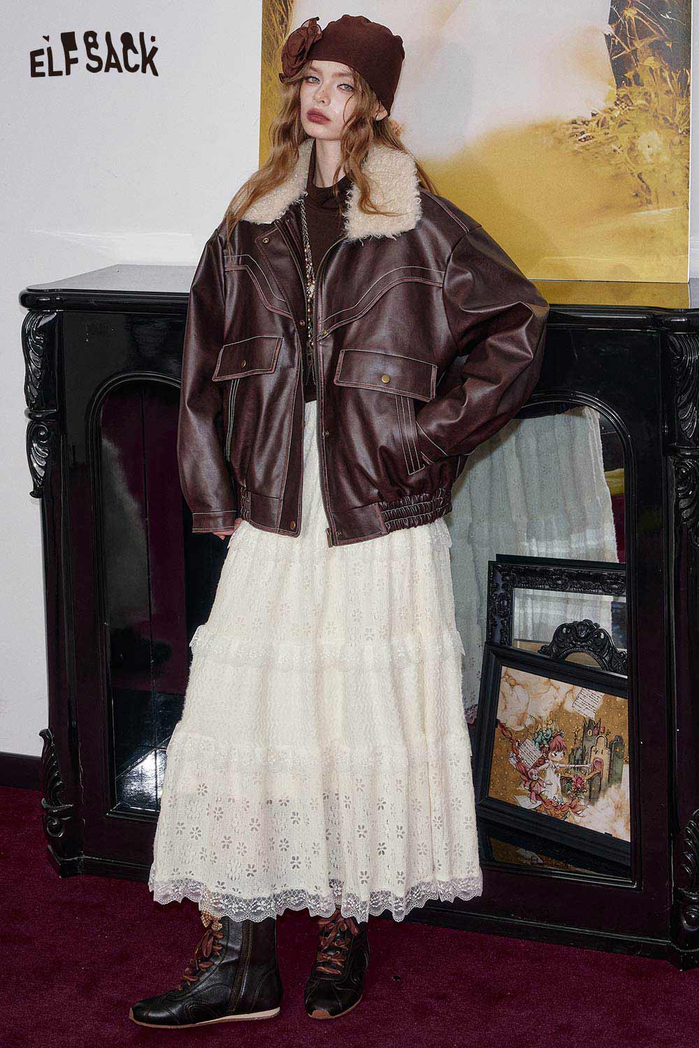 Model wearing a cotton blend floral maxi dress paired with a brown jacket and stylish boots