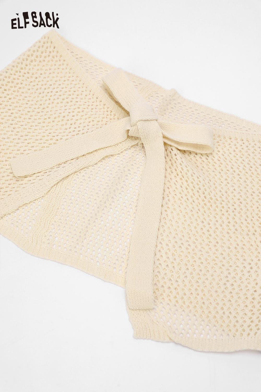 ELFSACK cotton blend knit skirt with apron featuring a stylish tie and open weave design