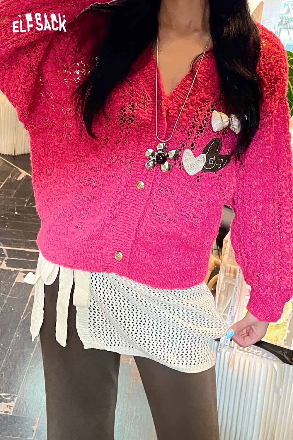 ELFSACK cotton blend knit skirt with apron styled with a bright pink cardigan