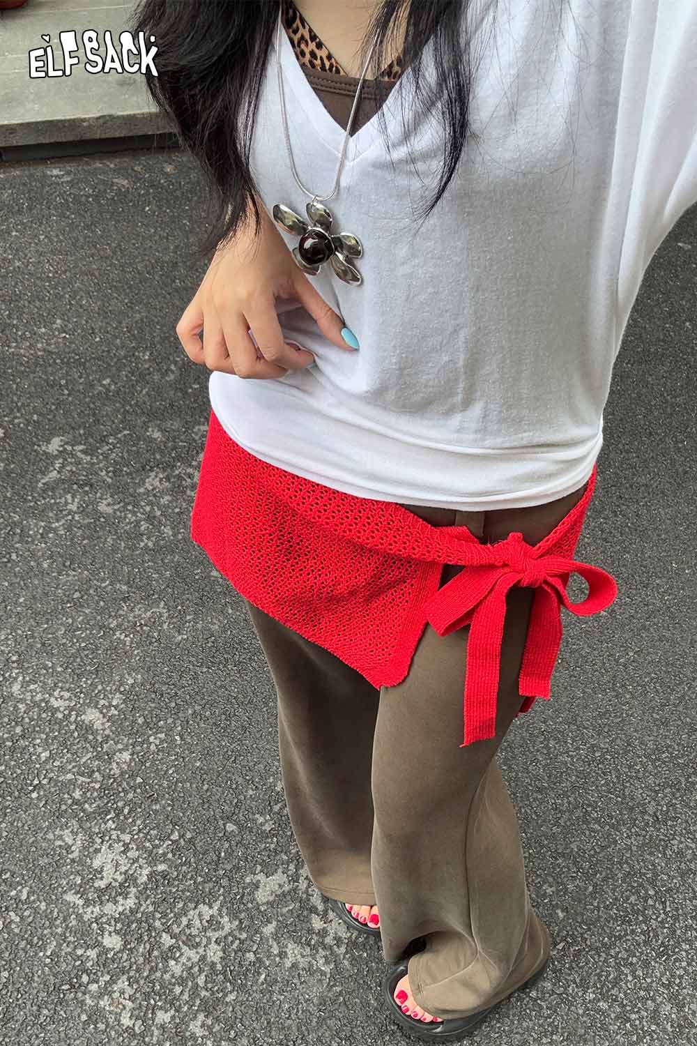 Stylish ELFSACK cotton blend knit skirt with apron tied at the waist for a fashionable look