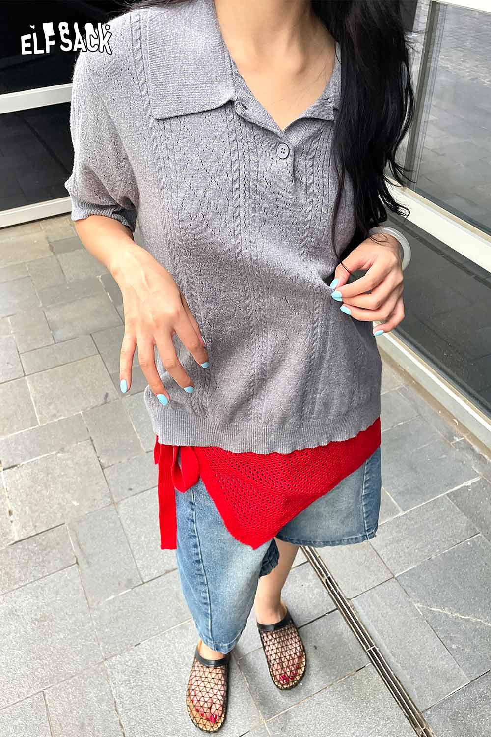 ELFSACK cotton blend knit skirt with apron styled with a grey top and casual shoes in an outdoor setting