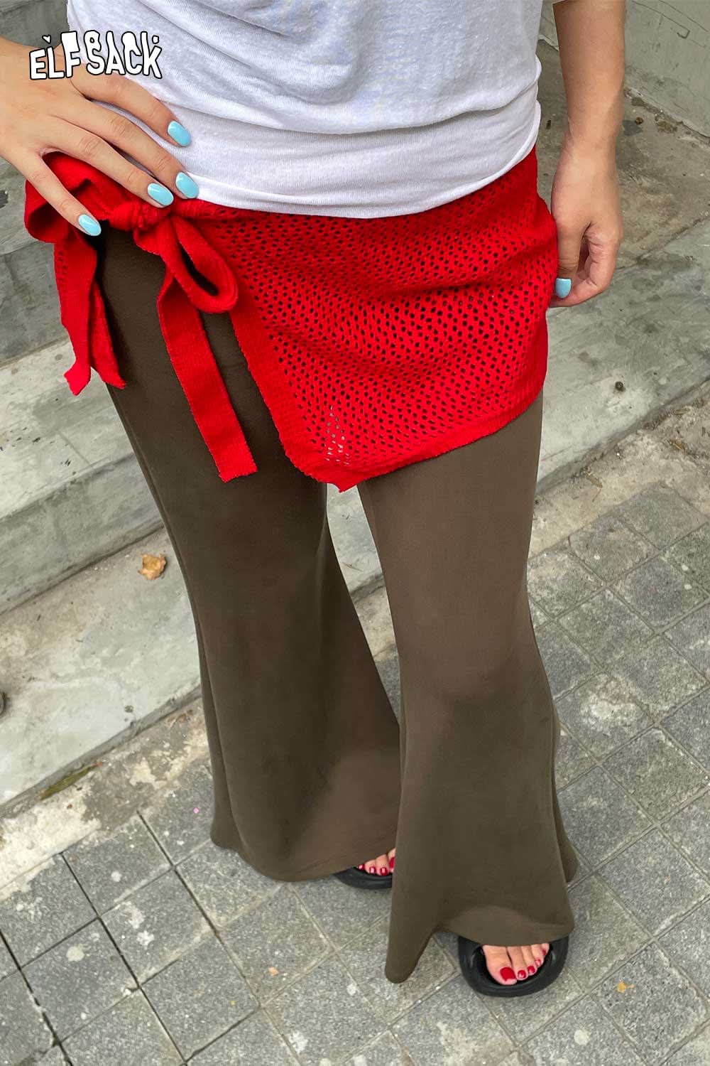 ELFSACK cotton blend knit skirt with apron paired with stylish flared pants for a trendy look