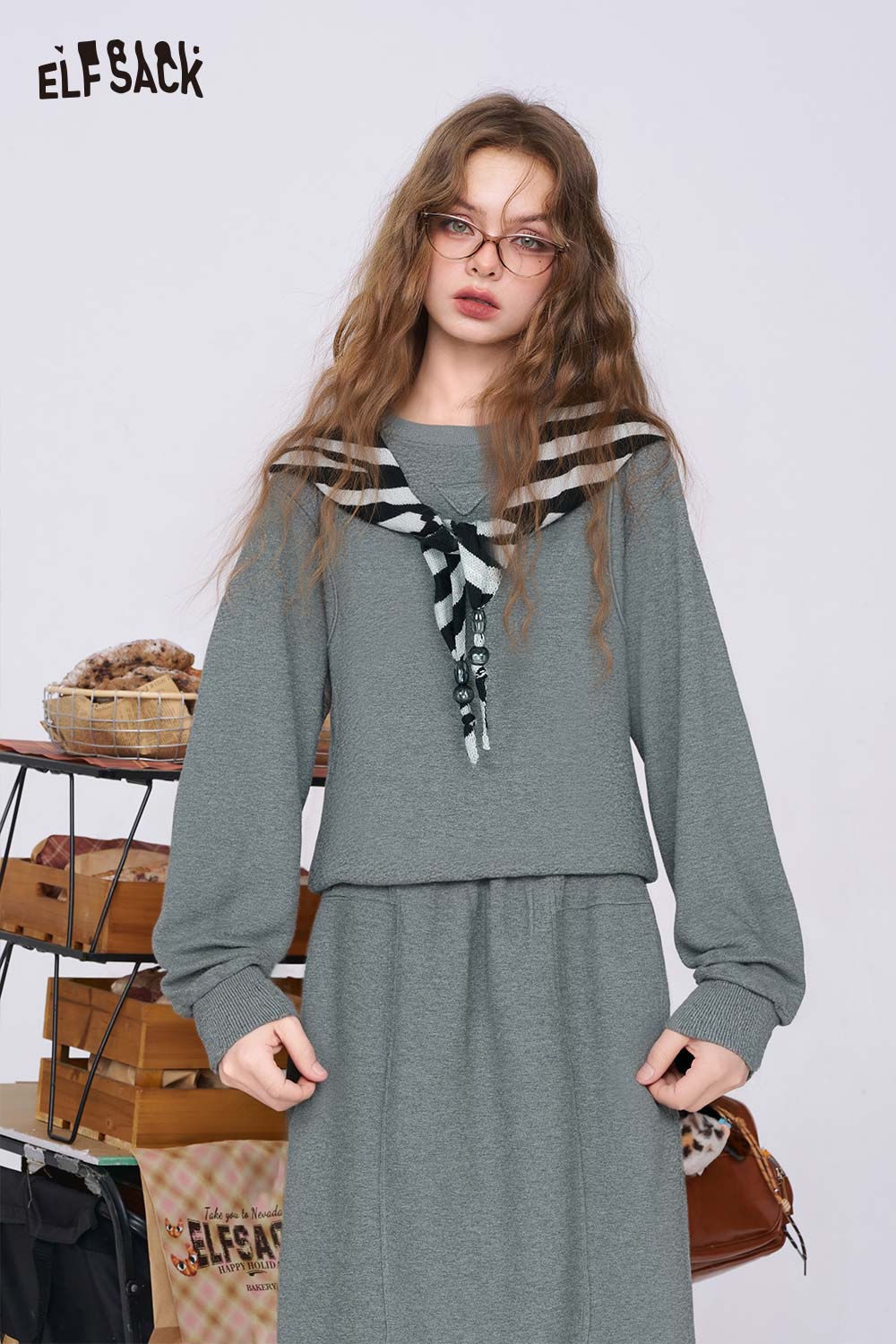 ELFSACK cotton blend two-piece set for women featuring a stylish sweater and matching skirt