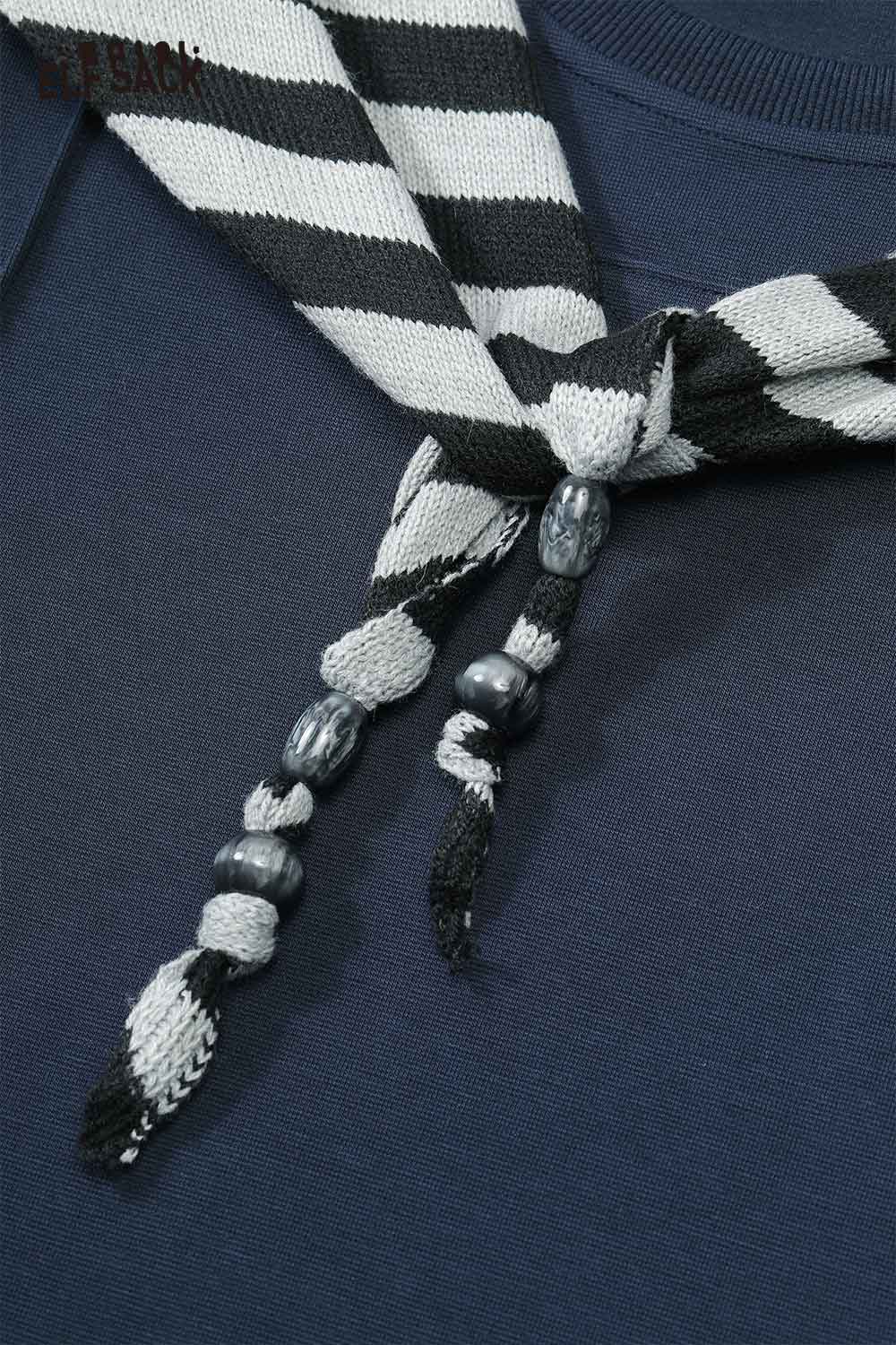 Close-up of ELFSACK cotton blend two-piece set for women with unique striped necktie detail