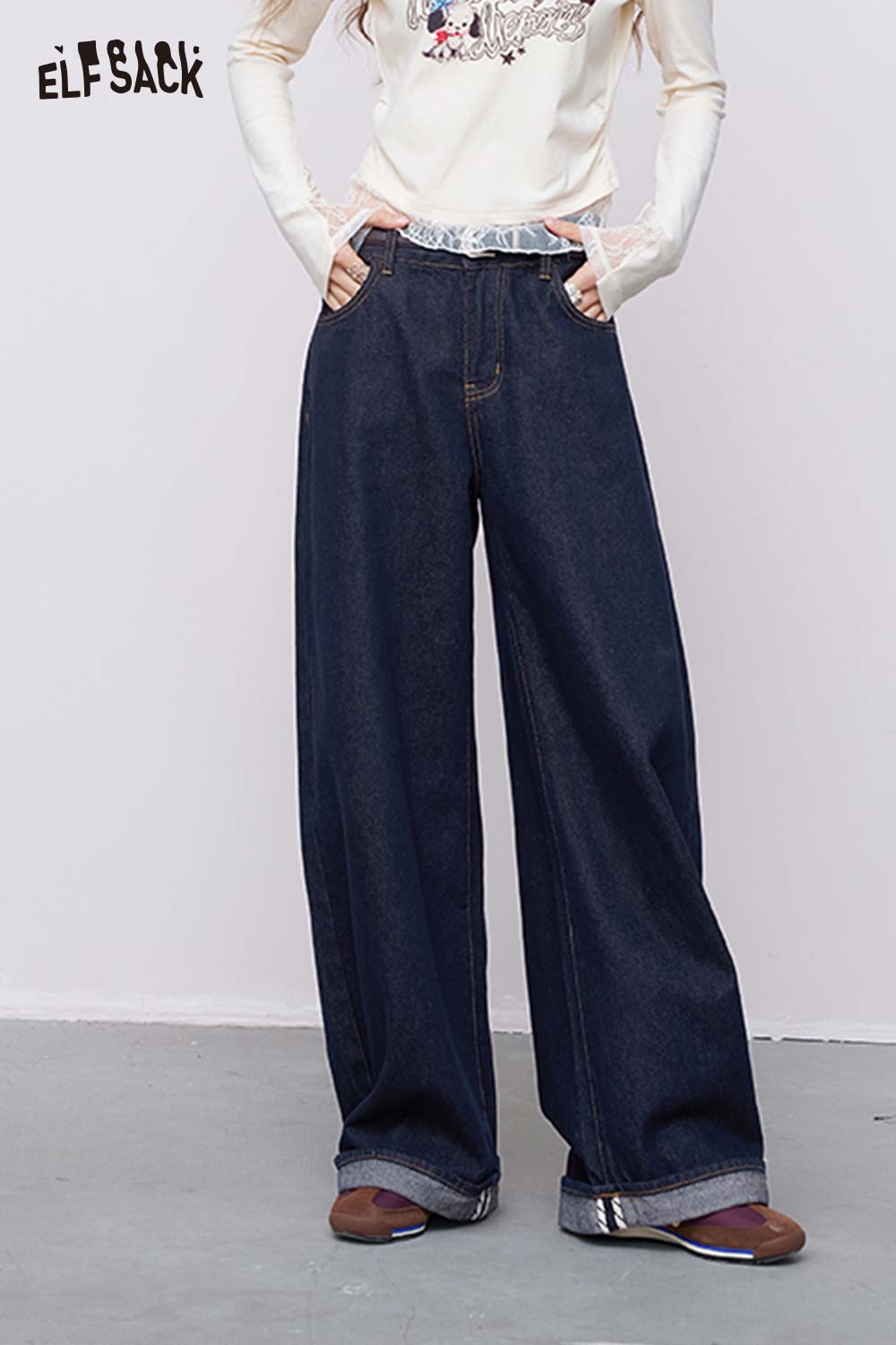 ELFSACK model wearing dark vintage straight leg jeans for women high waisted wide legs cuffed hems