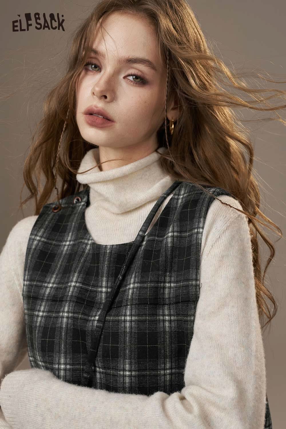 Model wearing ELFSACK cotton plaid loose fit dress layered over a turtleneck sweater