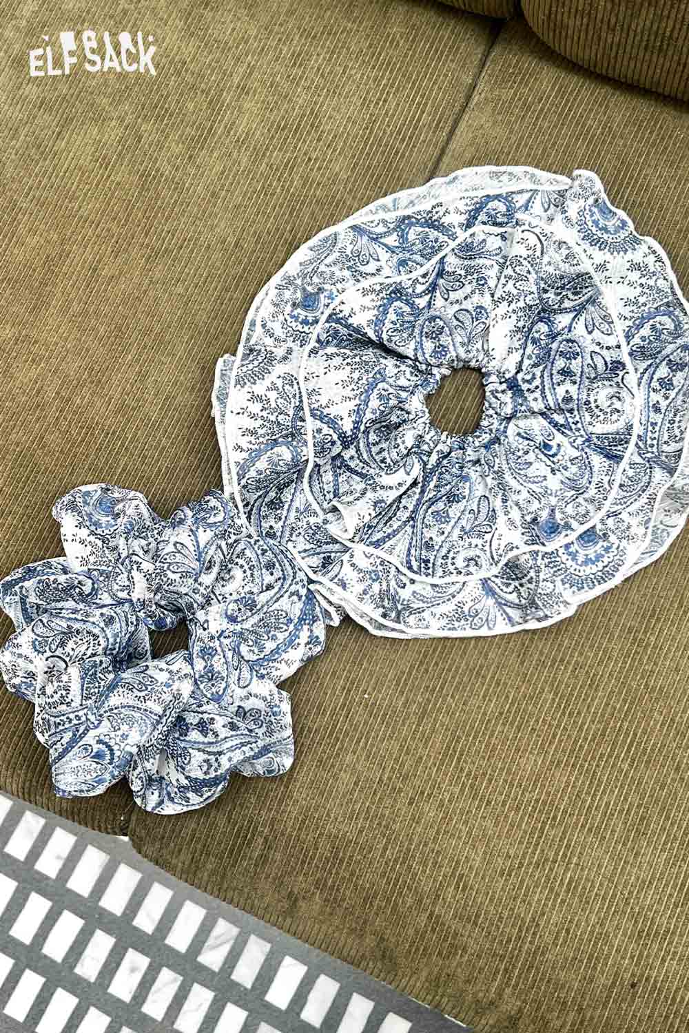 ELFSACK bohemian paisley hair tie set with blue and white ruffled scrunchies on beige couch