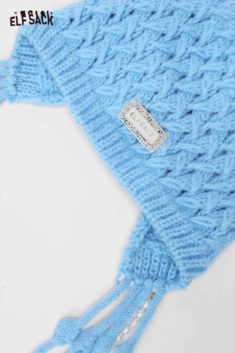 ELFSACK crocheted tassel ear-flap hat in light blue with decorative badge and tassels