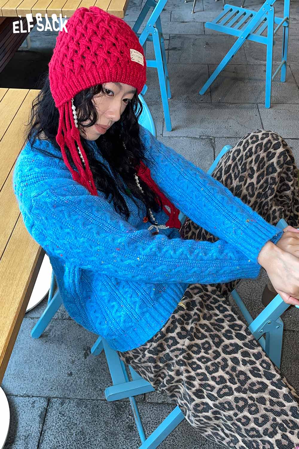 ELFSACK crocheted tassel ear-flap hat in red with stylish braids for winter fashion