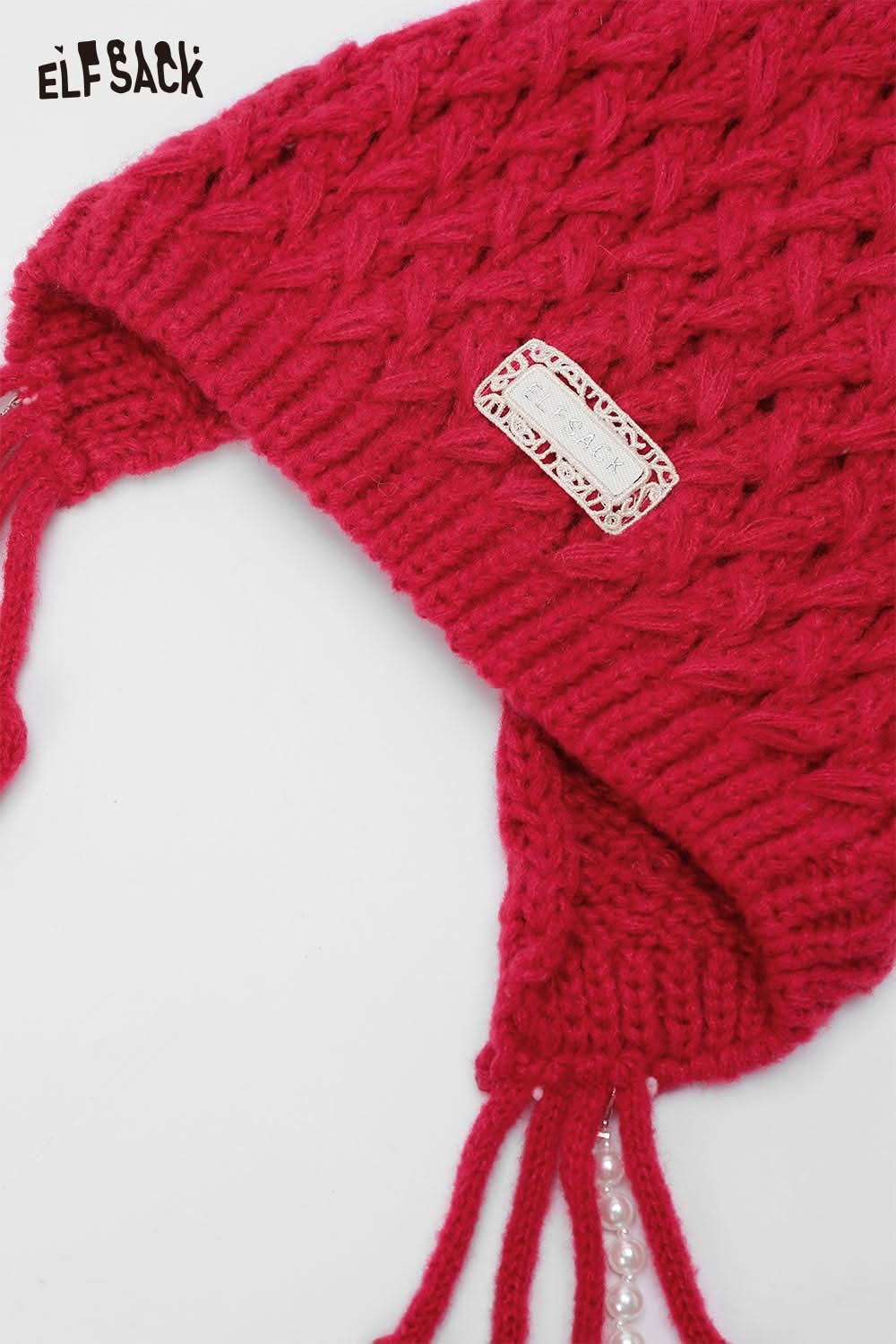 ELFSACK crocheted tassel ear-flap hat in vibrant red with decorative label and tassels