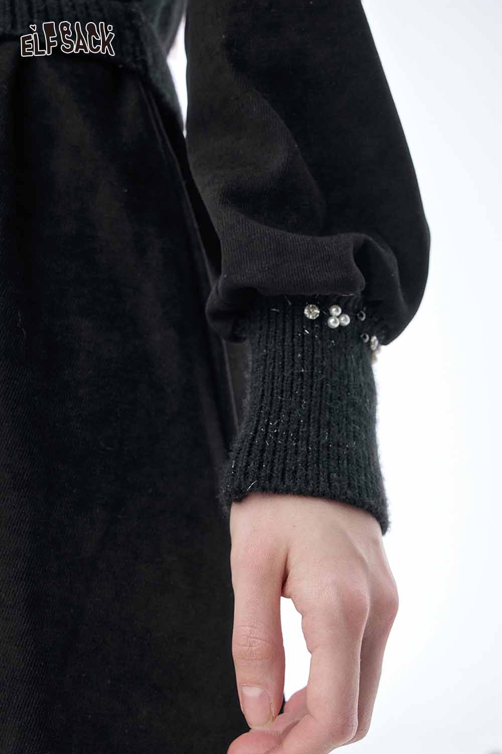 Close-up of the sleeve detail on an ELFSACK crystal accent midi dress featuring decorative crystal embellishments