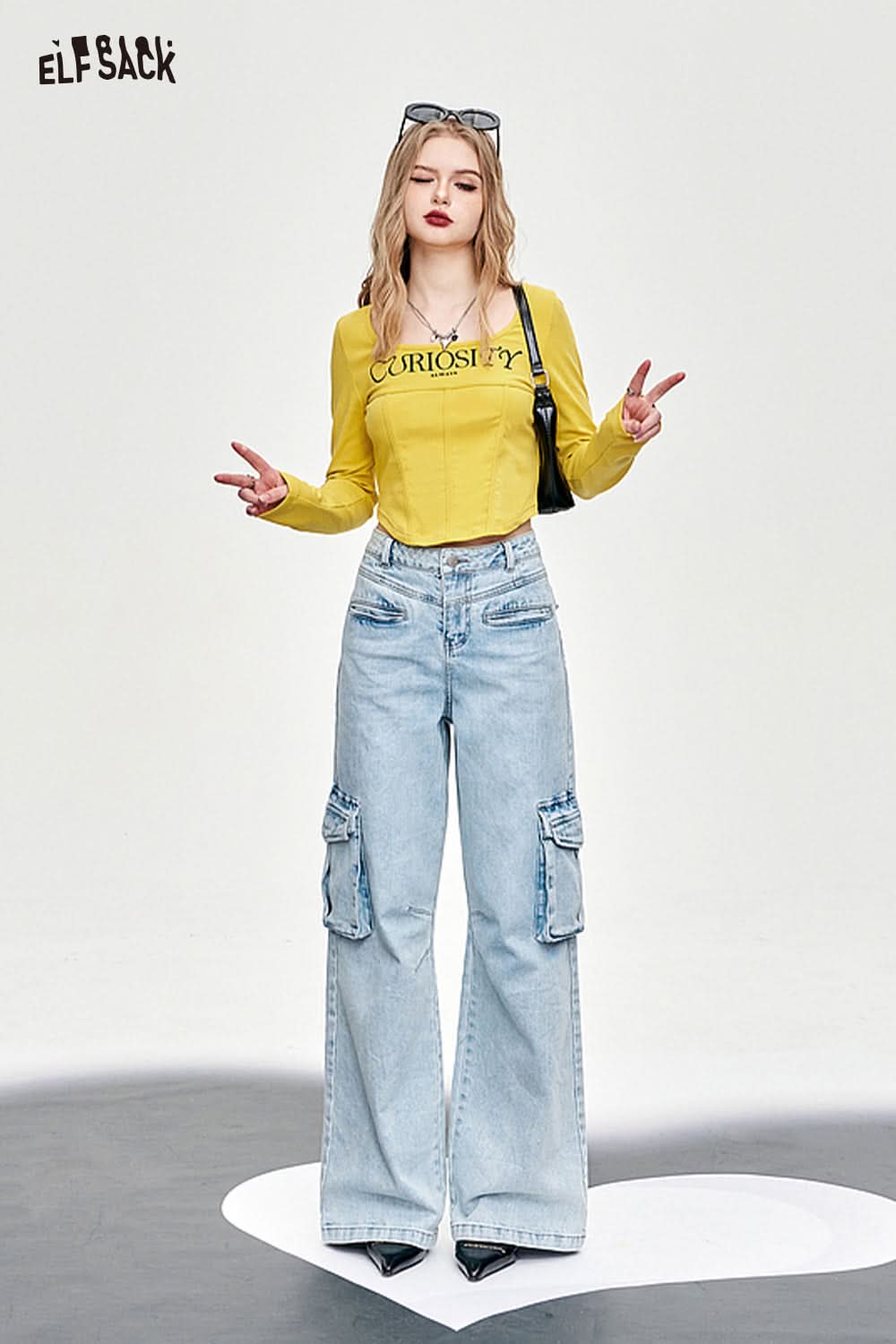 ELFSACK yellow Y2K Square Neck Fishbone Corset Style t-shirt worn with light blue wide-leg cargo jeans