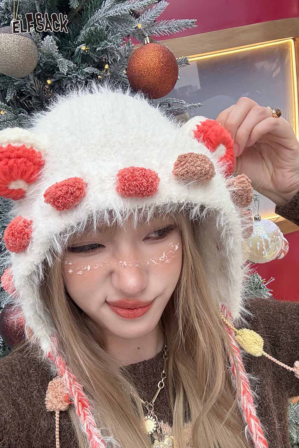 Cute 3D ear beanie hat by ELFSACK with colorful pom-poms and a cozy design for winter style