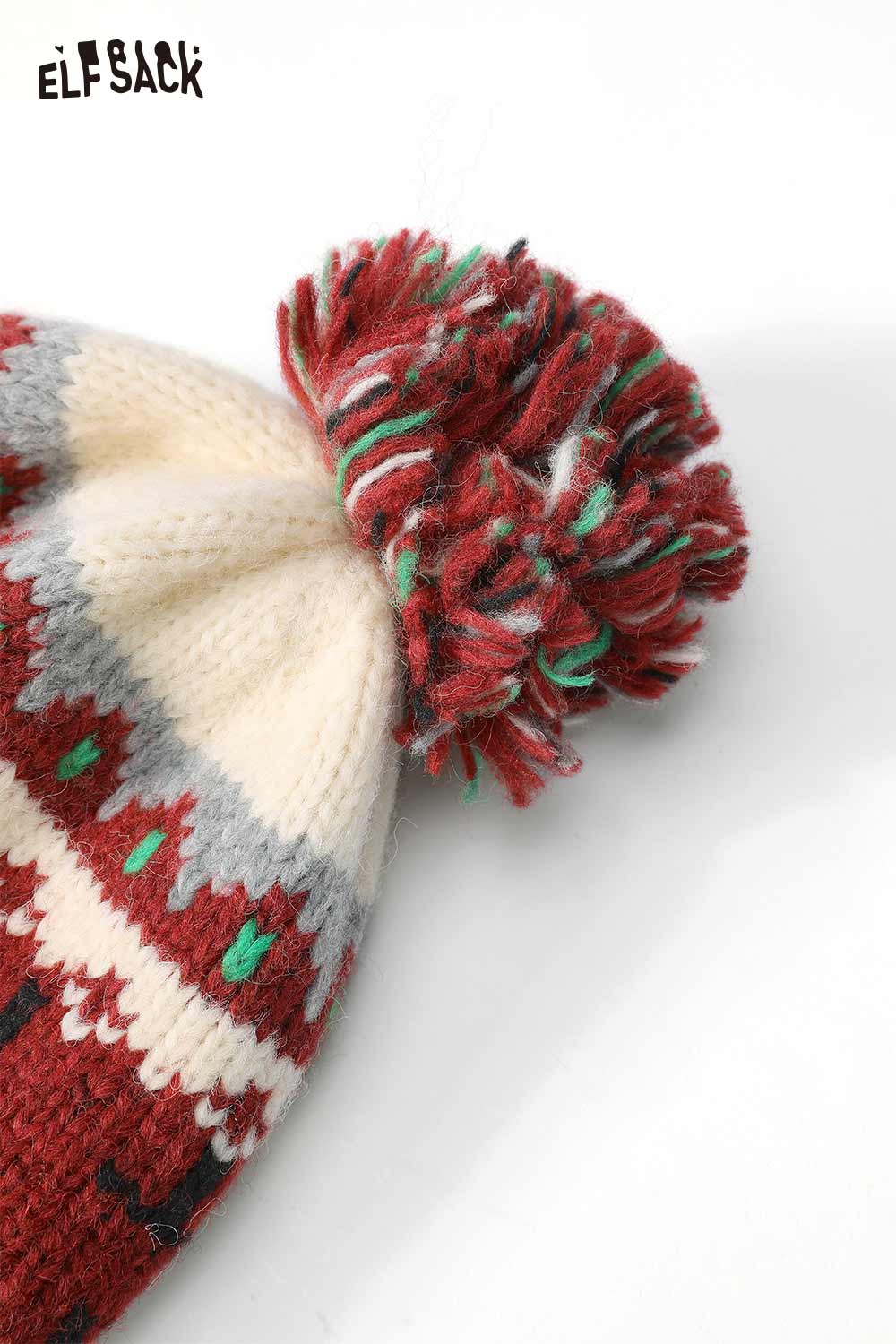 Cute Fair Isle knit beanie in red and cream with a pompom for stylish winter warmth