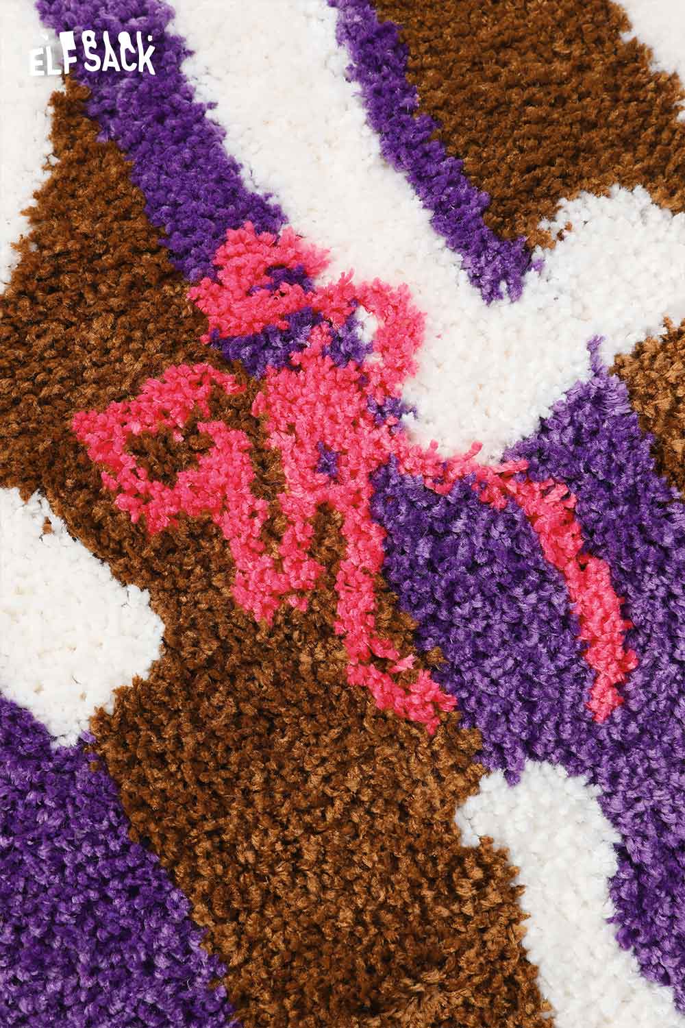 Cute round striped rug by ELFSACK featuring a vibrant design in purple and pink tones