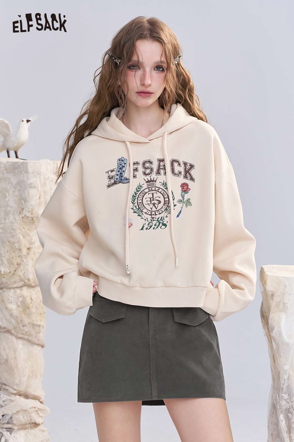 ELFSACK denim A-line mini skirt paired with a stylish cropped hoodie for a trendy look
