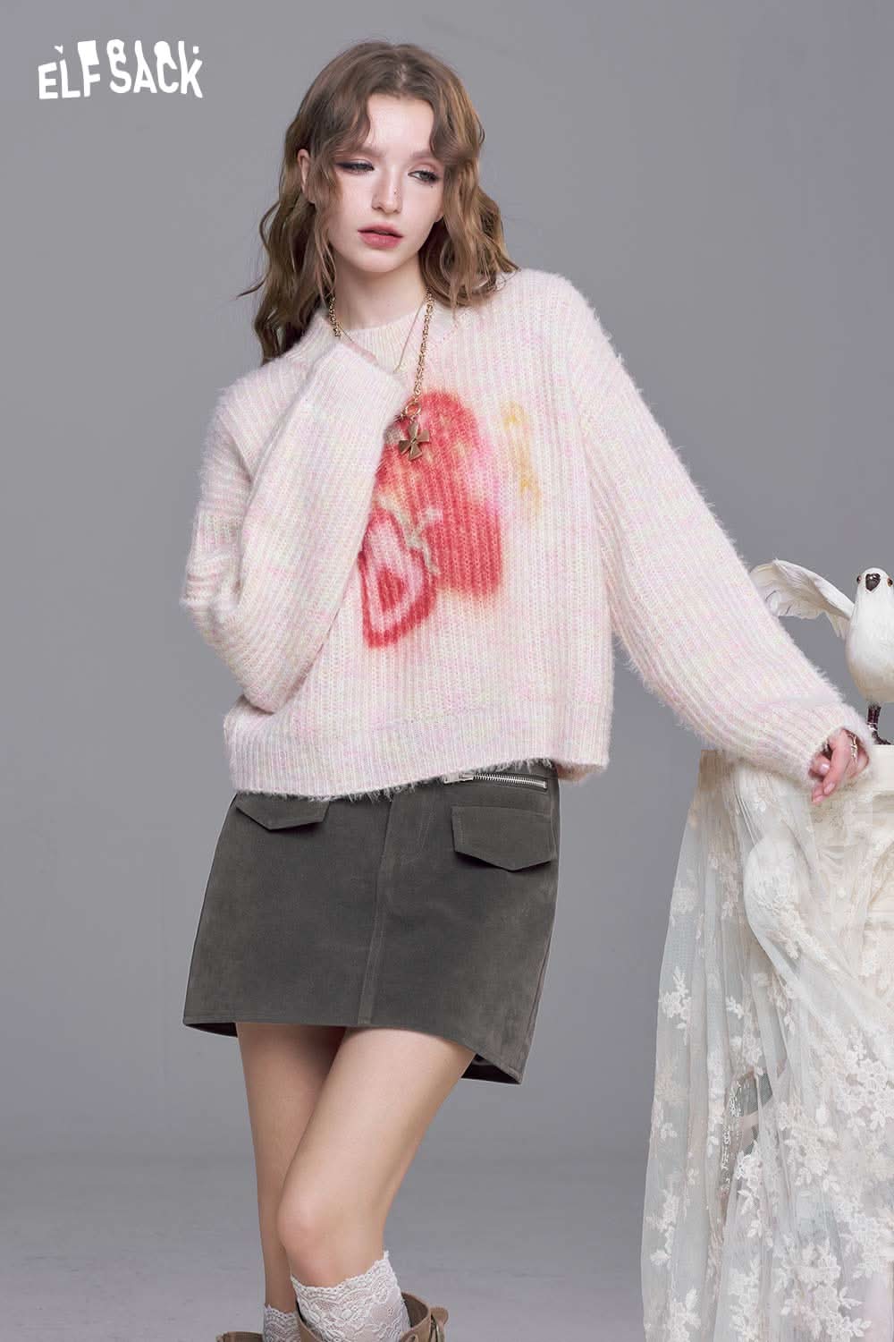 Stylish ELFSACK denim A-line mini skirt paired with a cozy pink sweater for a trendy look