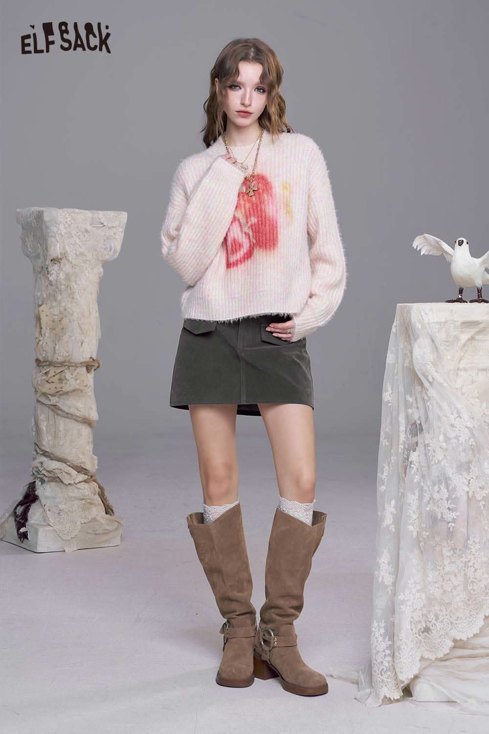 ELFSACK denim A-line mini skirt styled with a fluffy pink sweater and knee-high boots